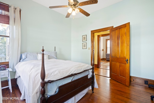 bedroom featuring ceiling fan and dark hardwood / wood-style flooring