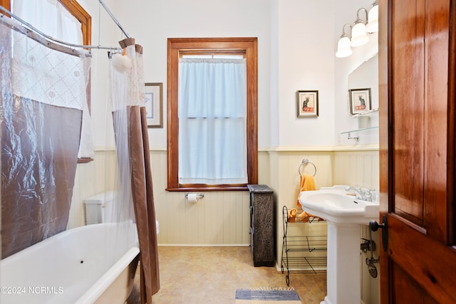 bathroom featuring shower / bathtub combination with curtain