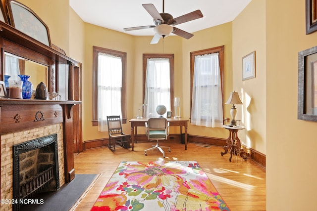 living area featuring ceiling fan and light wood-type flooring