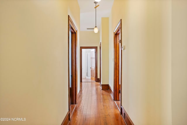 hallway with light wood-type flooring