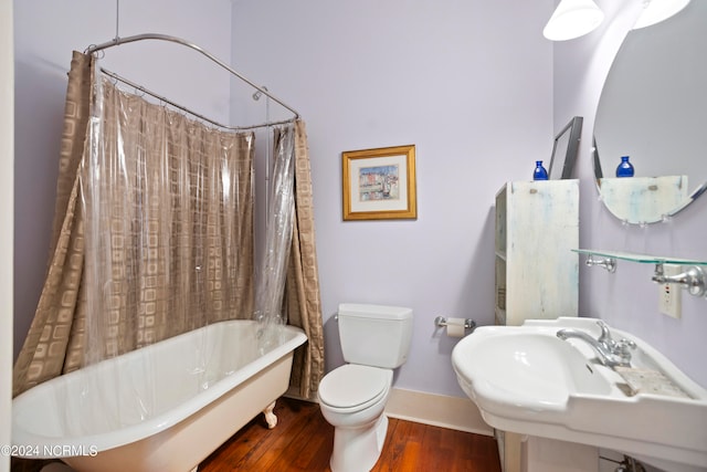 full bathroom with toilet, shower / tub combo with curtain, hardwood / wood-style flooring, and sink