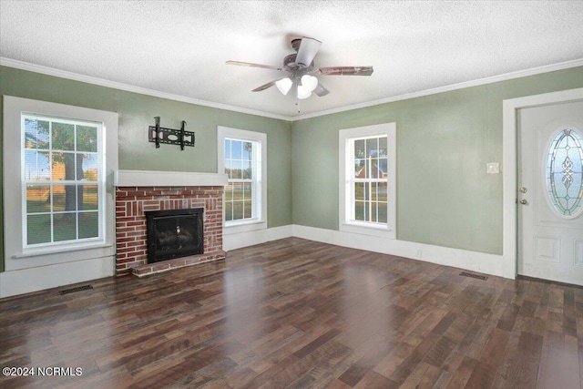 unfurnished living room featuring a textured ceiling, plenty of natural light, and dark hardwood / wood-style floors