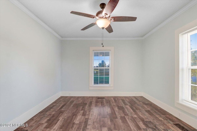 spare room featuring ornamental molding, dark wood-type flooring, and ceiling fan