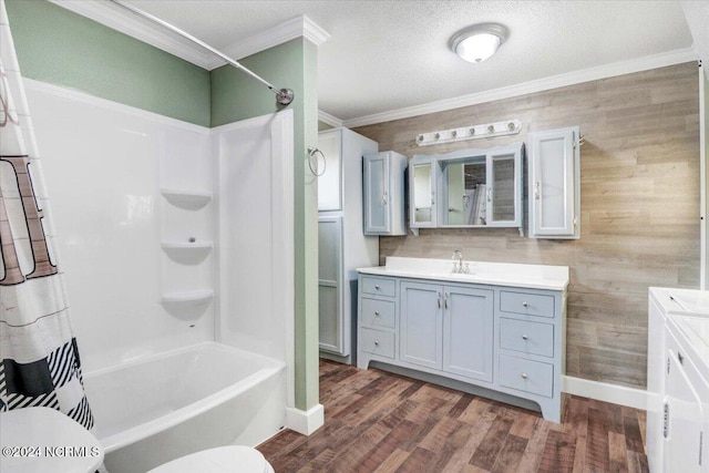 full bathroom featuring vanity, crown molding, hardwood / wood-style flooring, and toilet