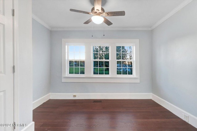 spare room with ornamental molding, dark hardwood / wood-style floors, and ceiling fan