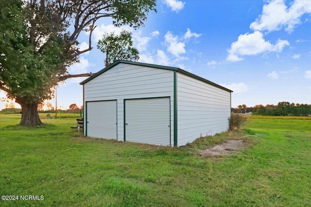 garage with a lawn