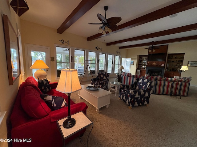 living room featuring ceiling fan, beam ceiling, and carpet floors