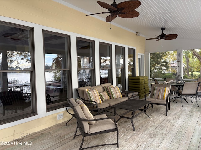 wooden deck featuring ceiling fan