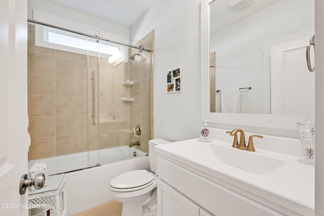 full bathroom with vanity, toilet, and enclosed tub / shower combo