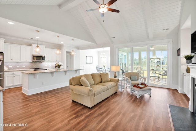 living room with beamed ceiling, hardwood / wood-style floors, high vaulted ceiling, and ceiling fan