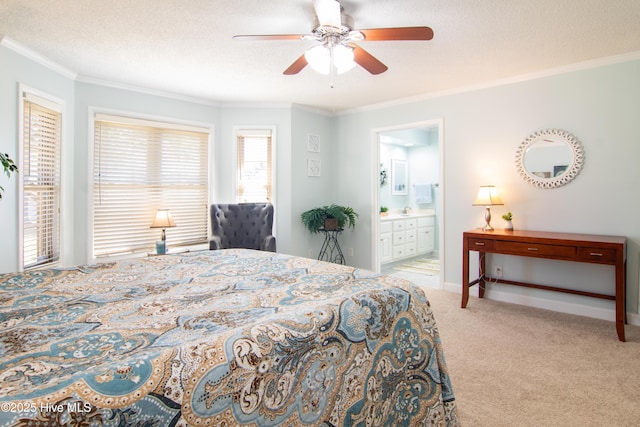 bedroom with a ceiling fan, a textured ceiling, ensuite bath, carpet, and crown molding