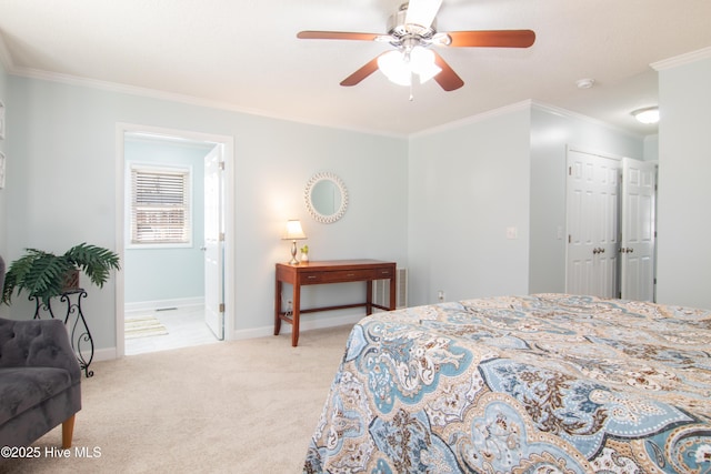 bedroom featuring baseboards, ornamental molding, carpet flooring, a closet, and a ceiling fan