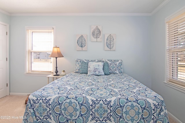 carpeted bedroom with baseboards and crown molding