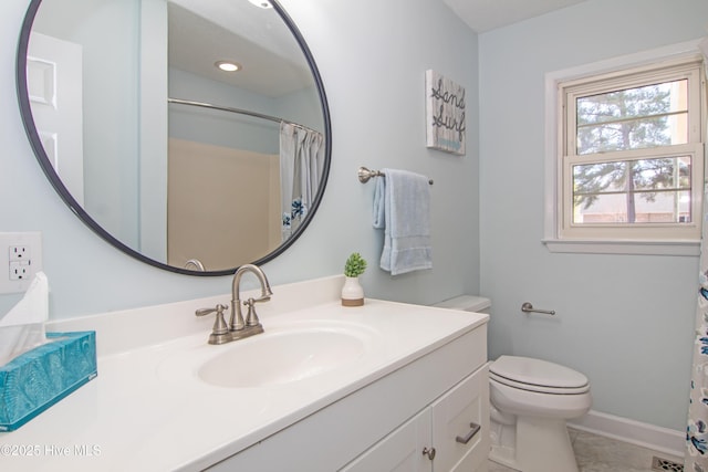 bathroom with baseboards, toilet, a shower with shower curtain, recessed lighting, and vanity