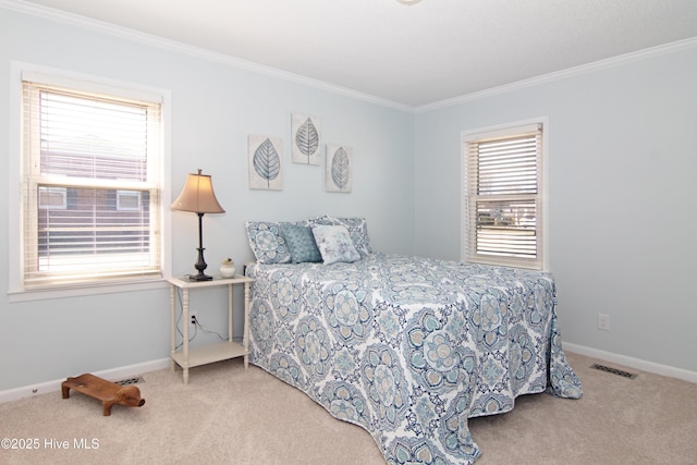 bedroom with visible vents, multiple windows, and carpet floors