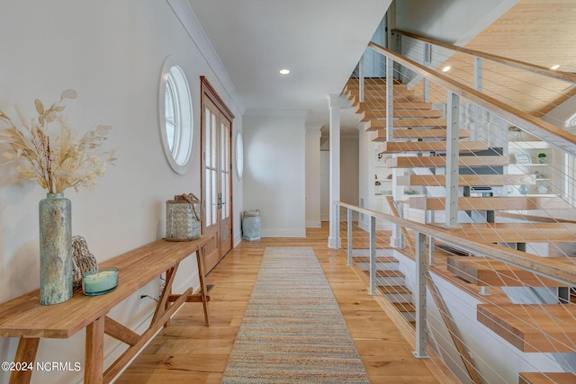 7 S Waterfront Pl, Hampstead, NC 28443 - entrance foyer with french doors, baseboards, ornamental molding, recessed lighting, and light wood-style flooring