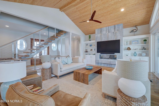 7 S Waterfront Pl, Hampstead, NC 28443 - living room with built in features, ceiling fan, high vaulted ceiling, stairway, and wooden ceiling