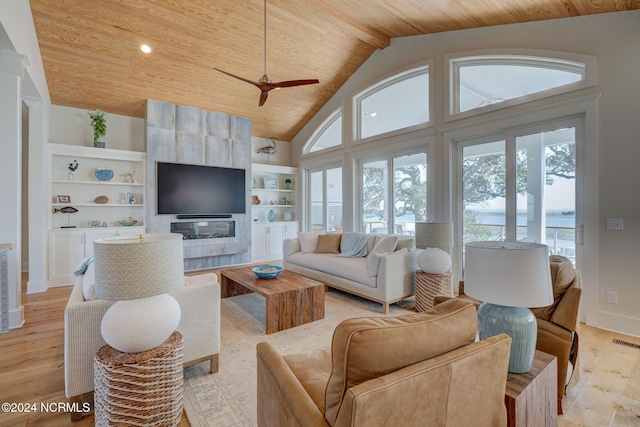 7 S Waterfront Pl, Hampstead, NC 28443 - living room with visible vents, light wood-style flooring, a ceiling fan, vaulted ceiling, and wood ceiling