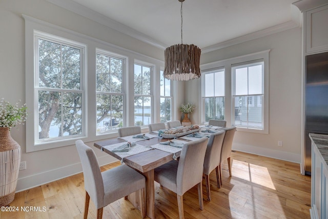 7 S Waterfront Pl, Hampstead, NC 28443 - dining space with baseboards, ornamental molding, light wood-type flooring, and a chandelier