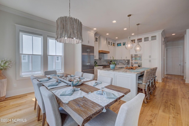 7 S Waterfront Pl, Hampstead, NC 28443 - dining room with recessed lighting, baseboards, ornamental molding, and light wood finished floors