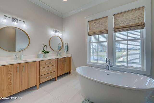 7 S Waterfront Pl, Hampstead, NC 28443 - full bath featuring plenty of natural light, a sink, tile patterned flooring, and double vanity