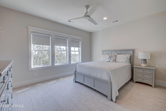 7 S Waterfront Pl, Hampstead, NC 28443 - bedroom featuring light colored carpet, baseboards, visible vents, and ceiling fan