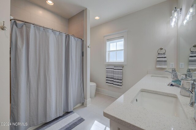 7 S Waterfront Pl, Hampstead, NC 28443 - full bathroom with a sink, tile patterned flooring, toilet, and double vanity