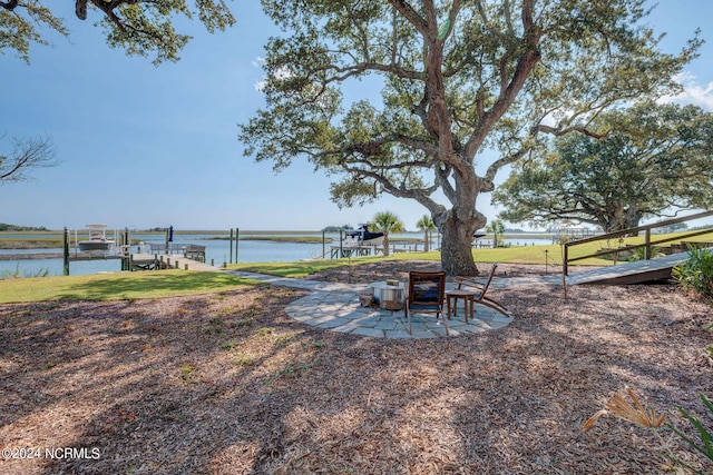 7 S Waterfront Pl, Hampstead, NC 28443 - view of yard featuring a water view, boat lift, and a boat dock