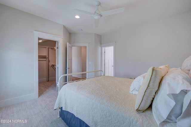 7 S Waterfront Pl, Hampstead, NC 28443 - carpeted bedroom featuring a walk in closet, a ceiling fan, baseboards, a closet, and recessed lighting