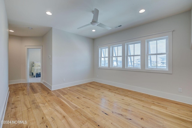7 S Waterfront Pl, Hampstead, NC 28443 - unfurnished room with baseboards, plenty of natural light, light wood-style flooring, and visible vents