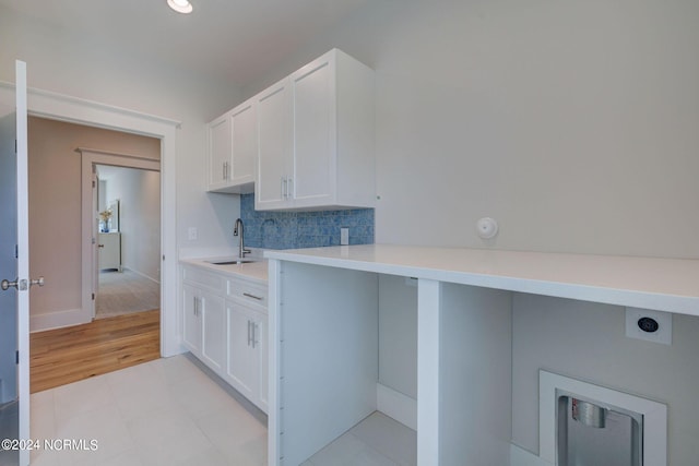 7 S Waterfront Pl, Hampstead, NC 28443 - laundry area featuring hookup for an electric dryer, cabinet space, a sink, baseboards, and recessed lighting