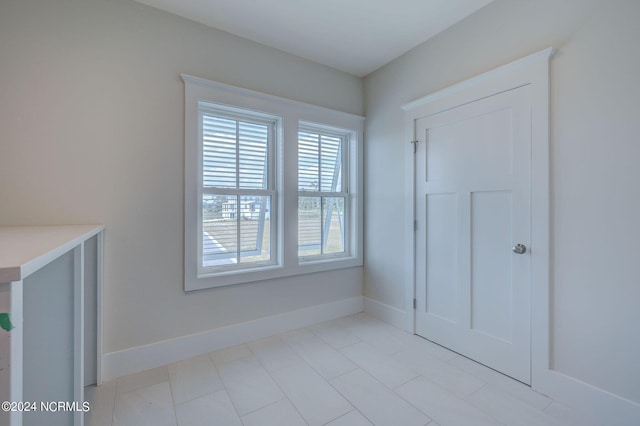 7 S Waterfront Pl, Hampstead, NC 28443 - interior space with light tile patterned floors and baseboards