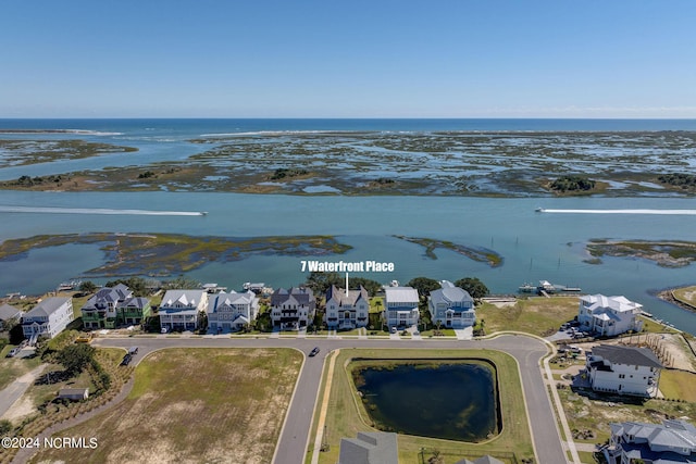 7 S Waterfront Pl, Hampstead, NC 28443 - drone / aerial view featuring a water view and a residential view