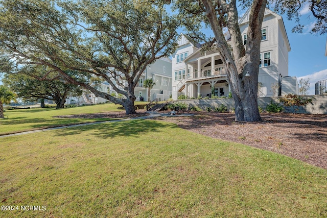 7 S Waterfront Pl, Hampstead, NC 28443 - view of front of home featuring stairs and a front lawn