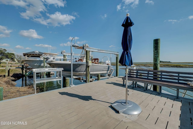 7 S Waterfront Pl, Hampstead, NC 28443 - view of dock featuring boat lift and a water view