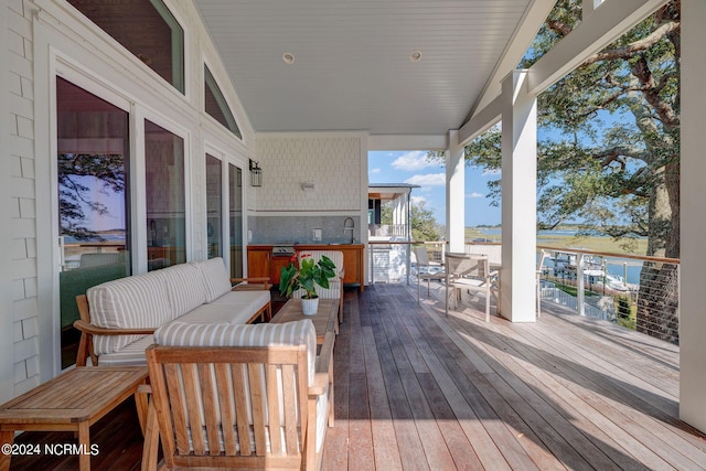 7 S Waterfront Pl, Hampstead, NC 28443 - wooden deck with an outdoor living space and a sink