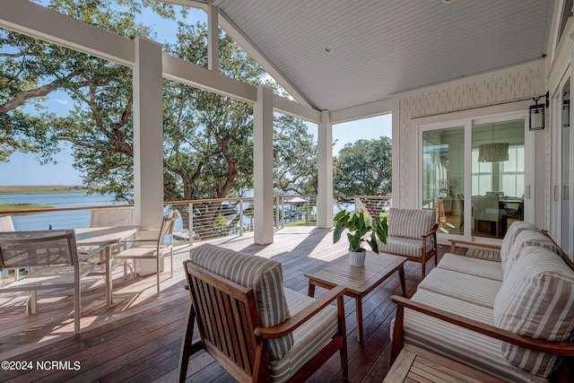 7 S Waterfront Pl, Hampstead, NC 28443 - wooden deck with an outdoor hangout area, outdoor dining space, and a water view
