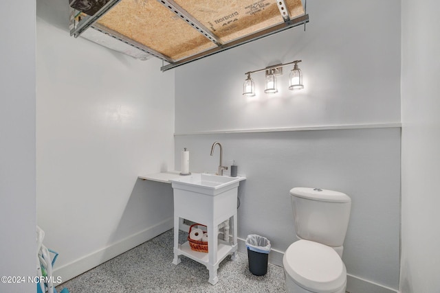 7 S Waterfront Pl, Hampstead, NC 28443 - half bath with baseboards, toilet, and speckled floor
