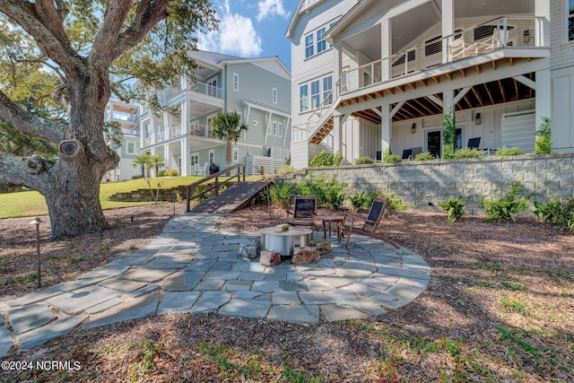 7 S Waterfront Pl, Hampstead, NC 28443 - view of community featuring a patio and a fire pit