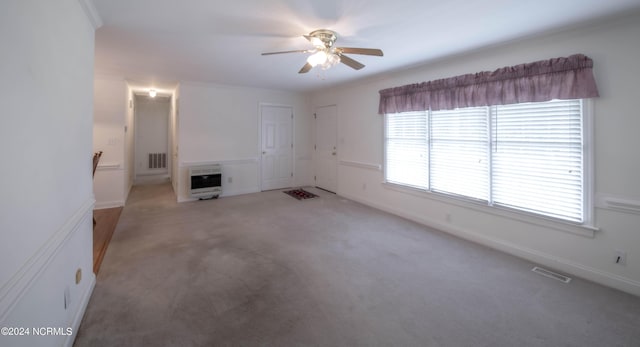 7724 US Highway 264a, Bailey, NC 27807 - unfurnished living room featuring heating unit, ceiling fan, light colored carpet, and baseboards