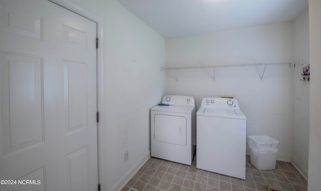 laundry area featuring washing machine and clothes dryer