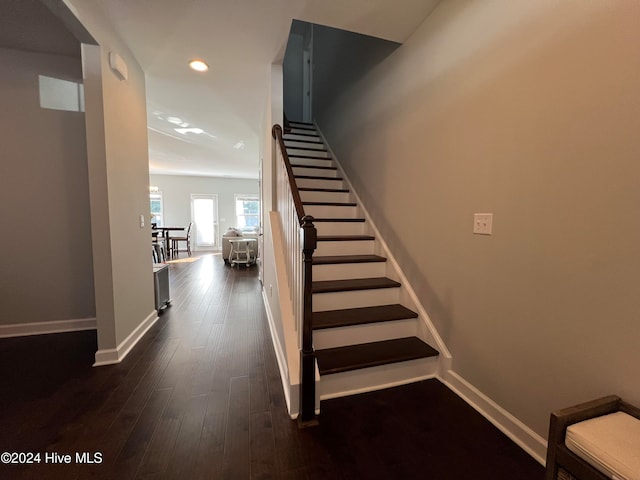 stairs with hardwood / wood-style floors