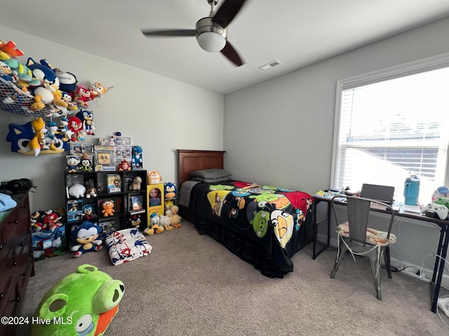 carpeted bedroom with ceiling fan