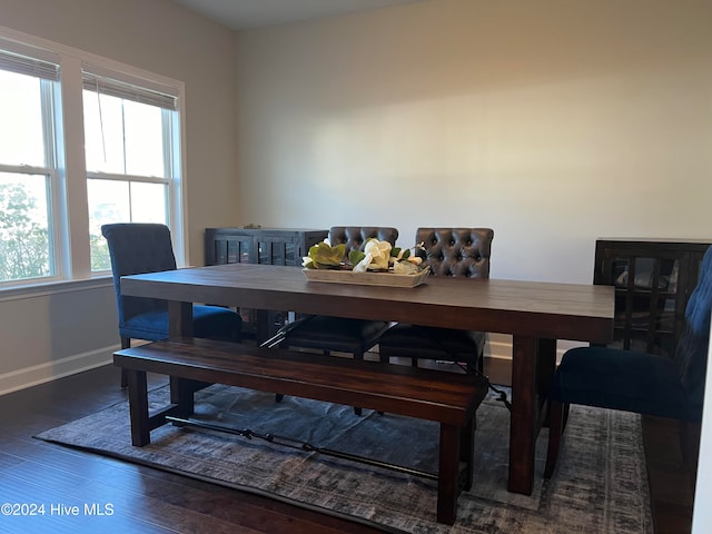 dining room with dark hardwood / wood-style flooring