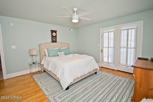 bedroom featuring light wood-type flooring, access to outside, and ceiling fan