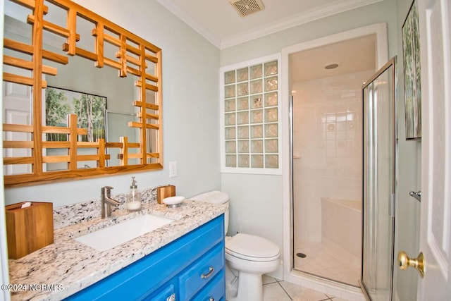 bathroom featuring tile patterned flooring, ornamental molding, a shower with door, and toilet