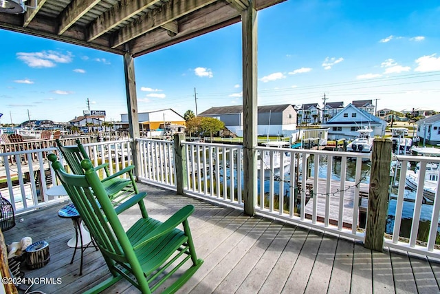 wooden terrace with a water view