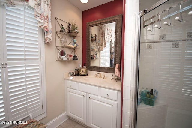 bathroom with vanity, tile patterned floors, and a shower with shower door