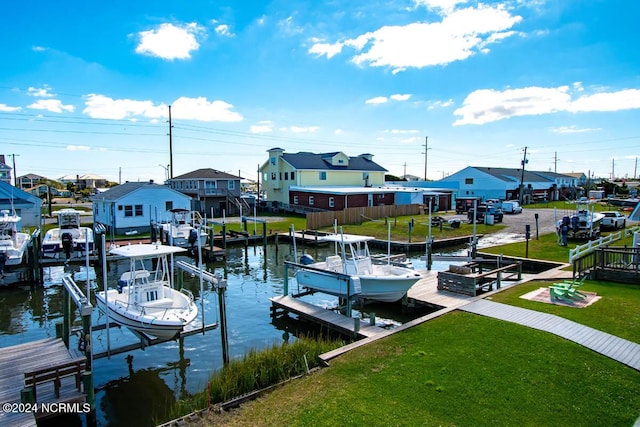 view of dock featuring a water view and a lawn