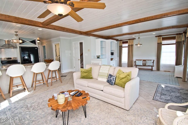 living room with crown molding, a wealth of natural light, wood ceiling, and light tile patterned floors